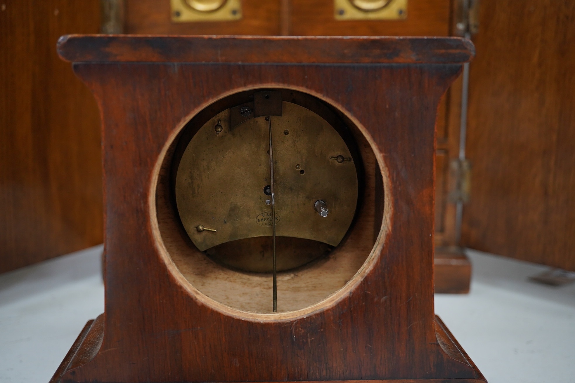 A Victorian oak two door, four drawer, vertu cabinet, with brass drawer military style handles and walnut timepiece, 29cm high, 28cm wide. Condition - fair to good